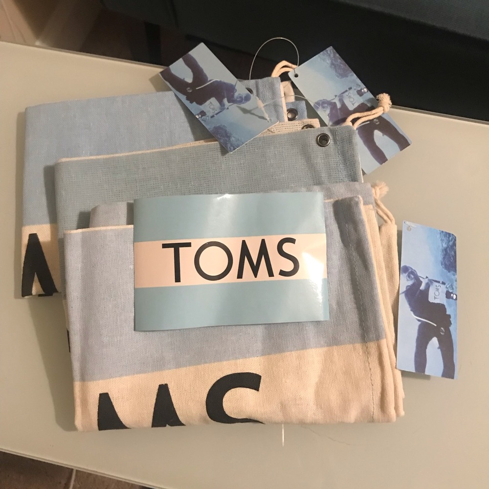 3 TOMS shoe bags & 1 Sticker